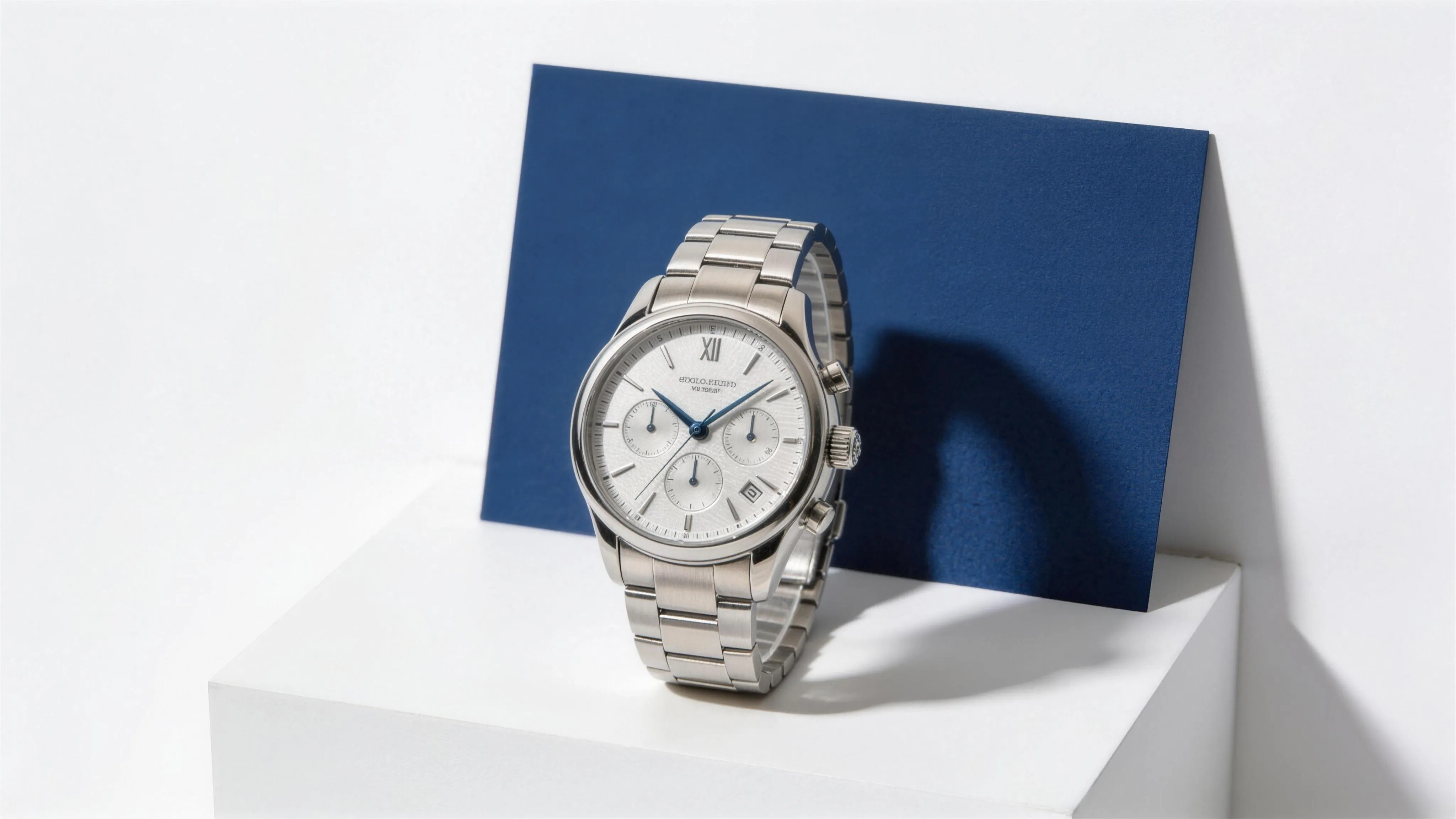 A premium watch on a white display plinth